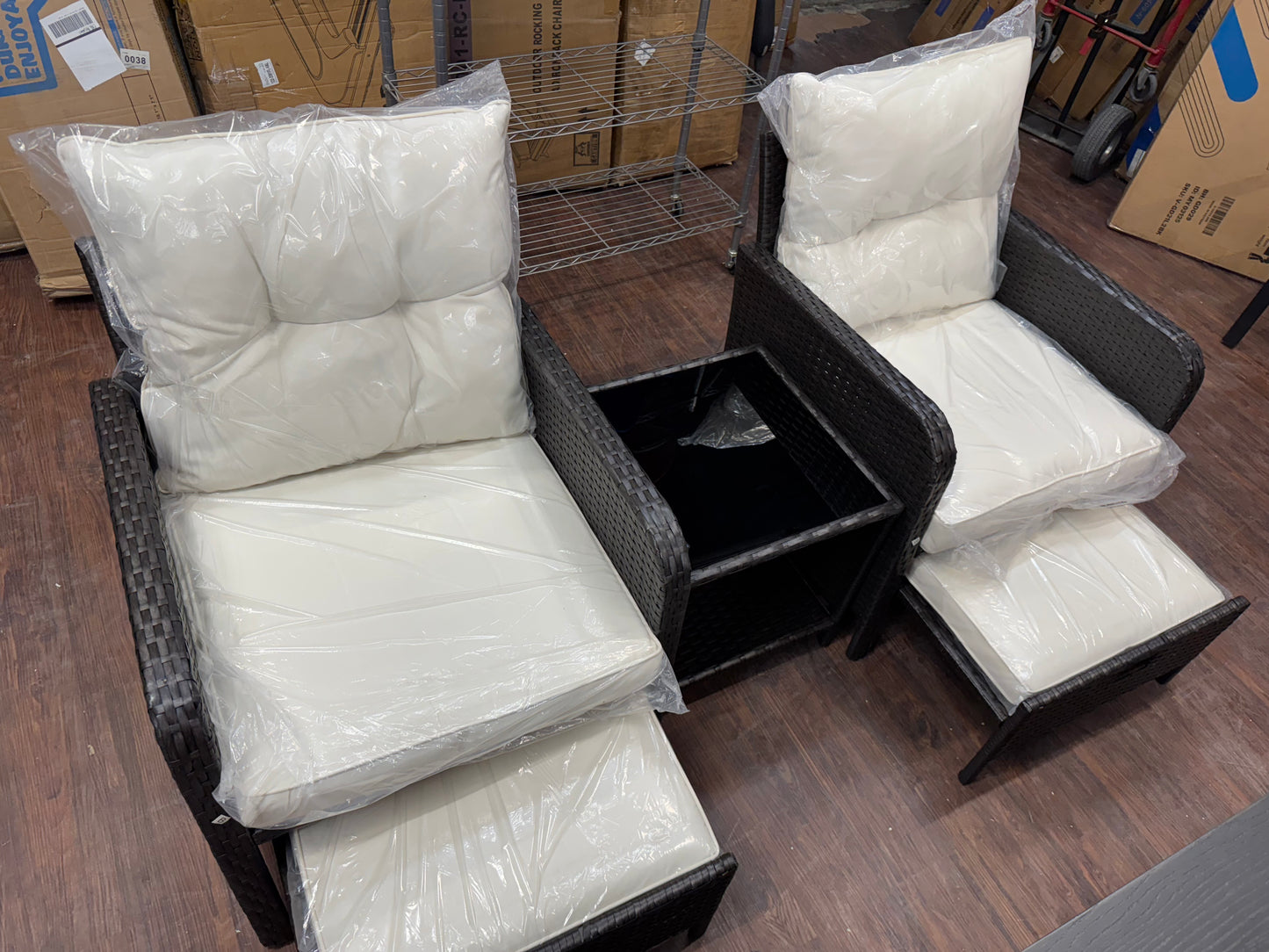 Patio furniture 2 chairs table and foot stools.