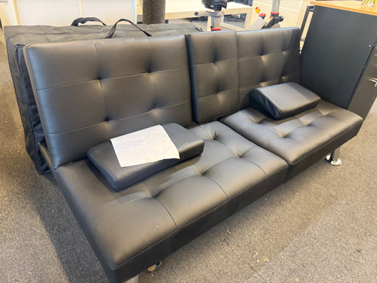 Black futon sofa with cup holders